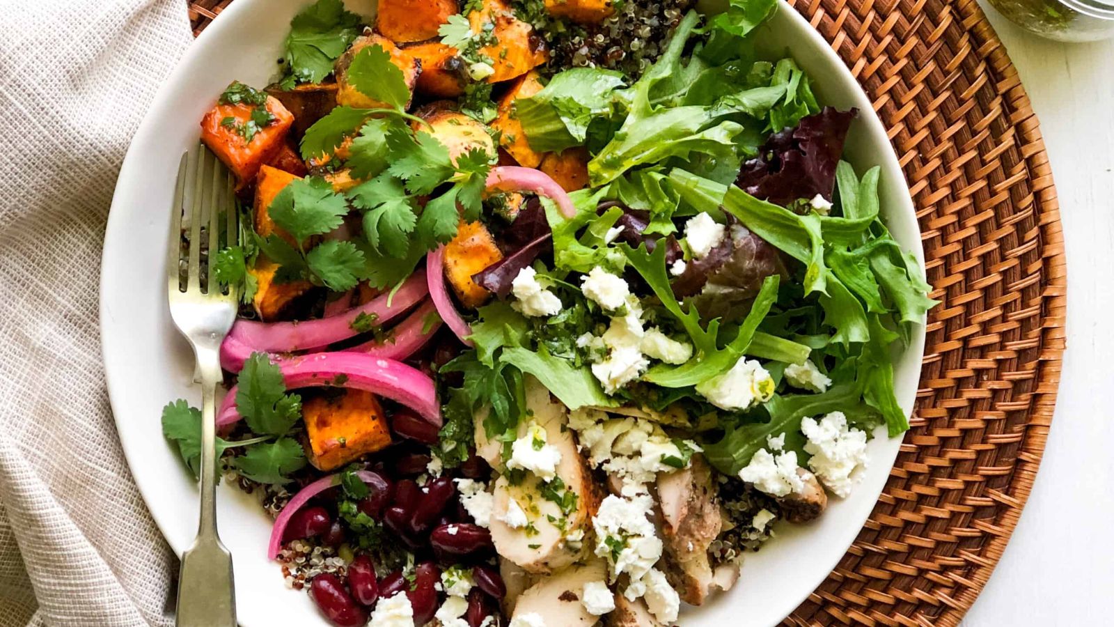 Grain bowl with fork on the side.