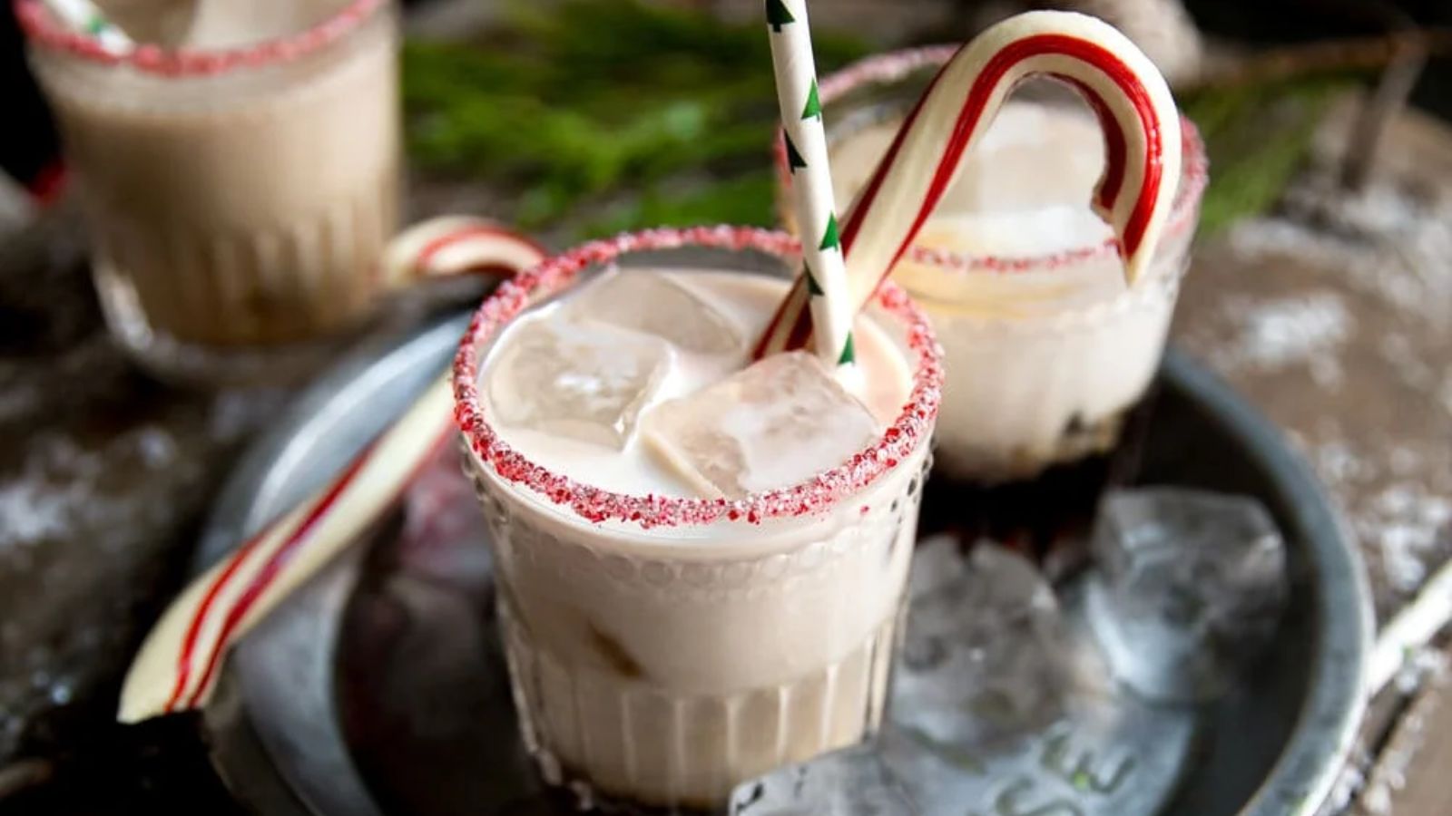 White russian cocktail with candy cane.