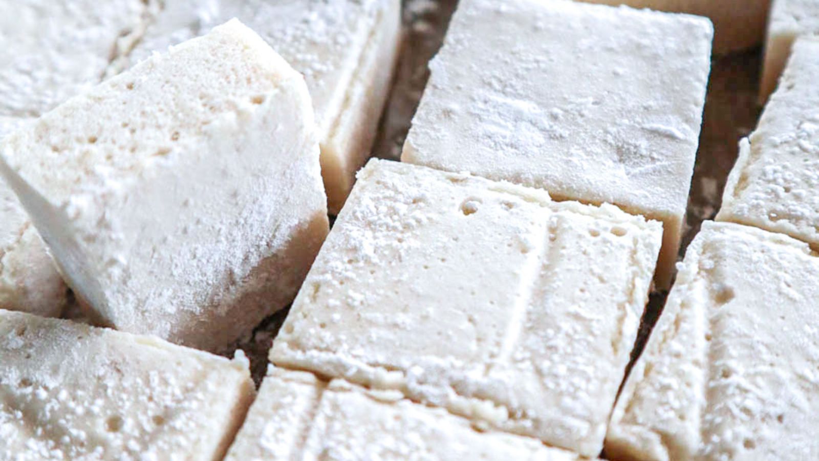 Marshmallow squares with powder.