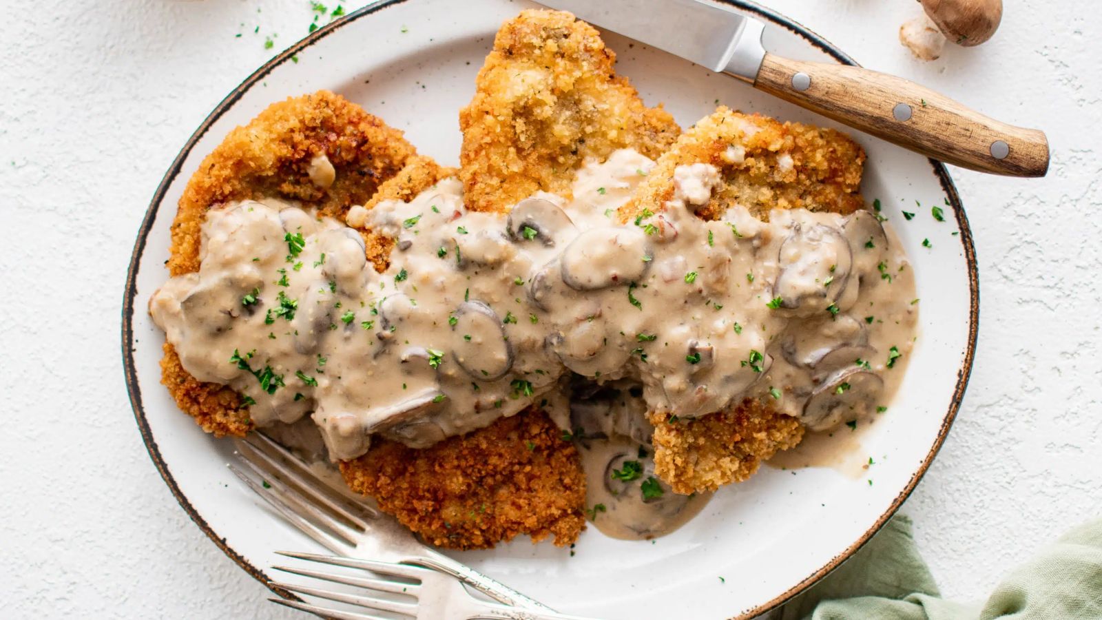 Pork with mushroom and gravy.