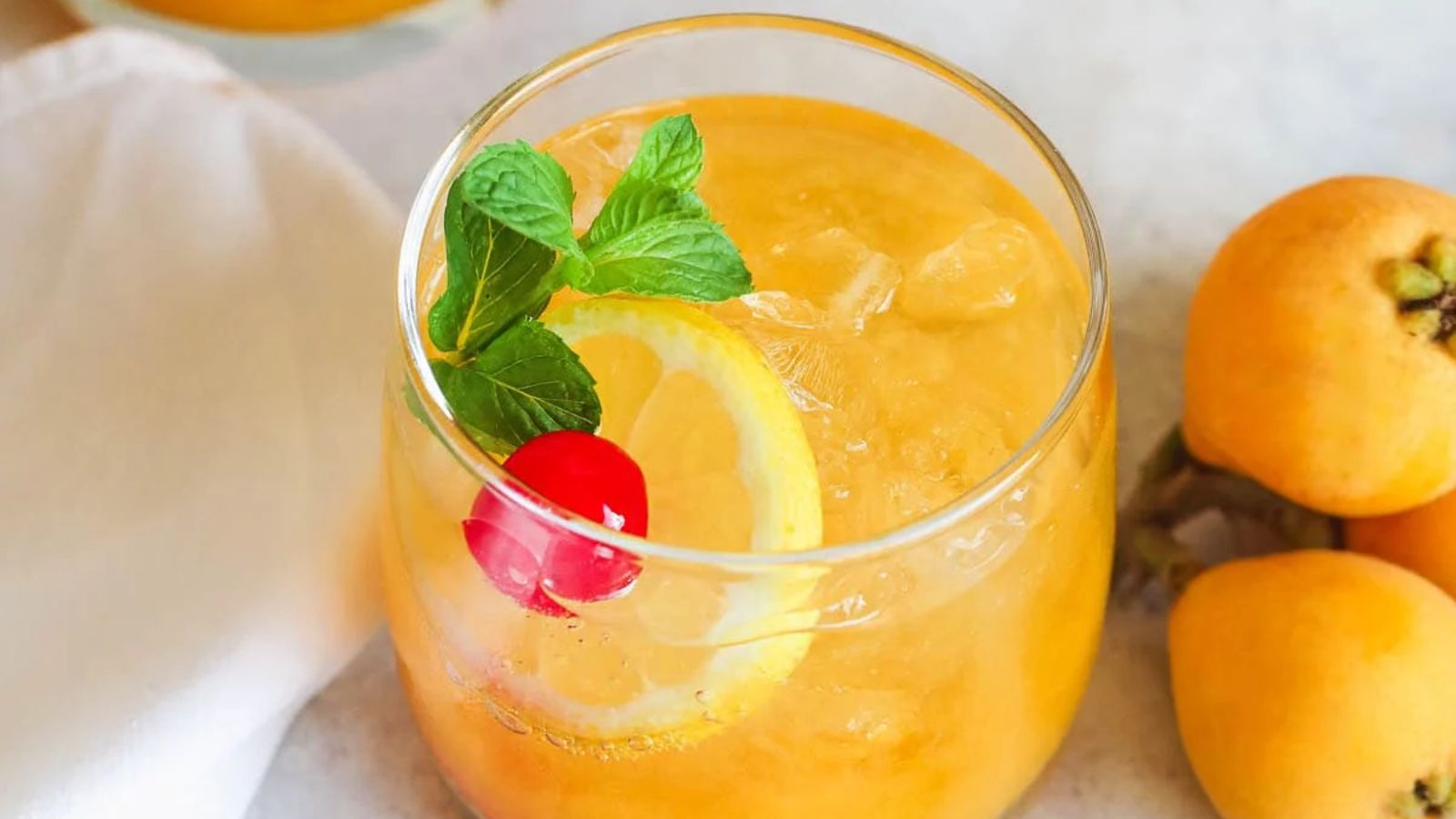 Vodka cocktail with sliced orange.