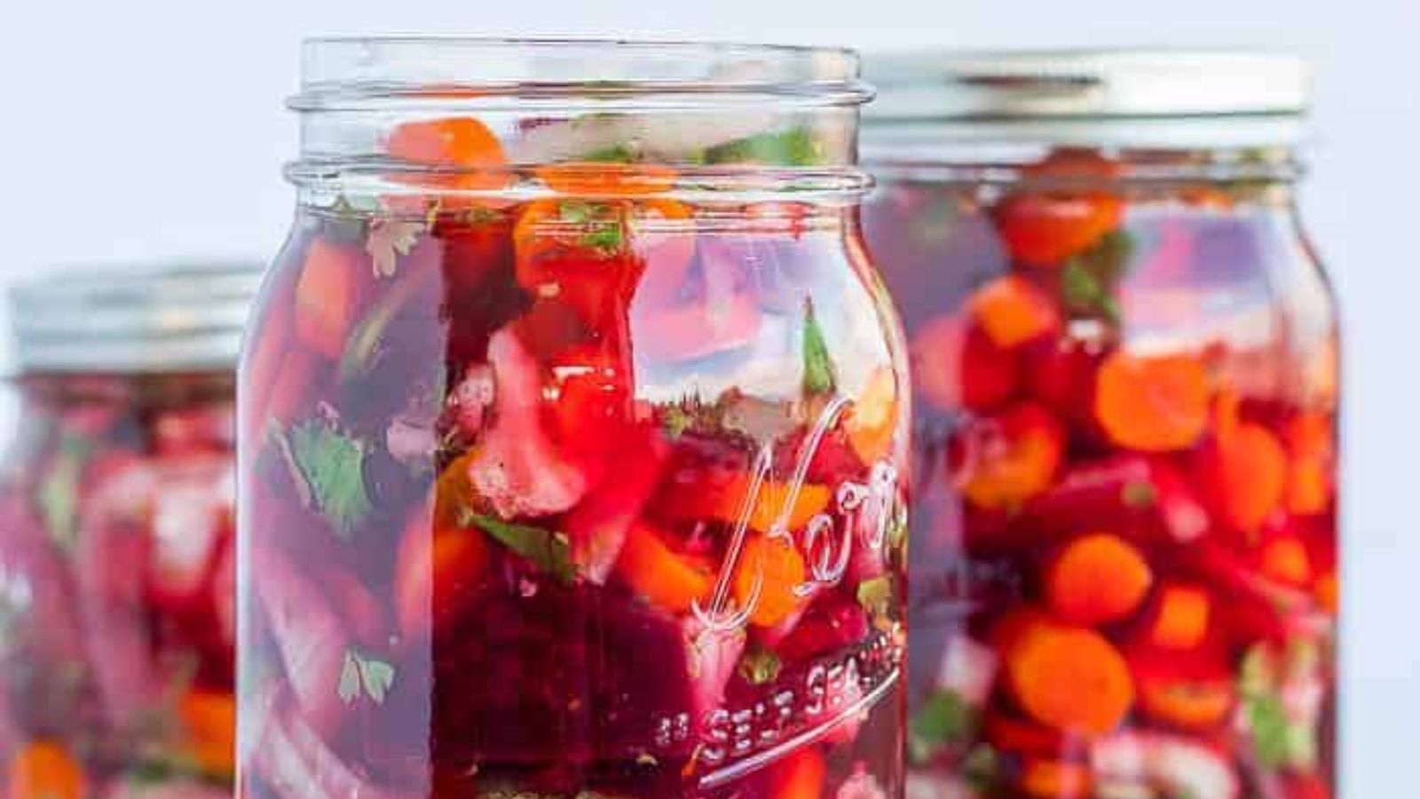 Pickled vegetables in a glass jar.
