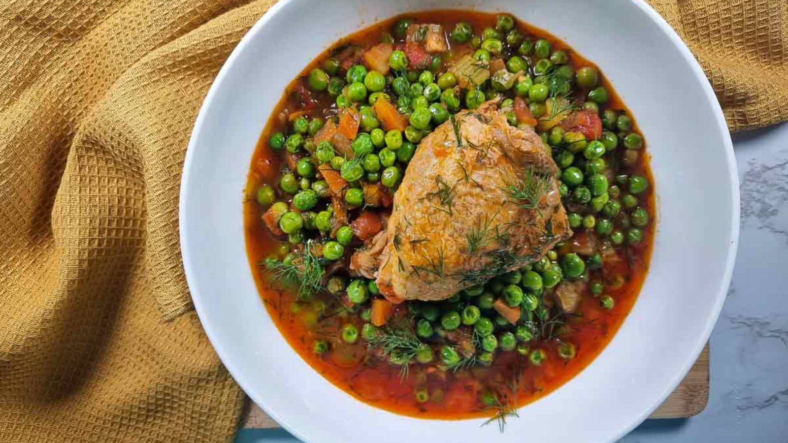 Peas and chicken stew in a bowl.