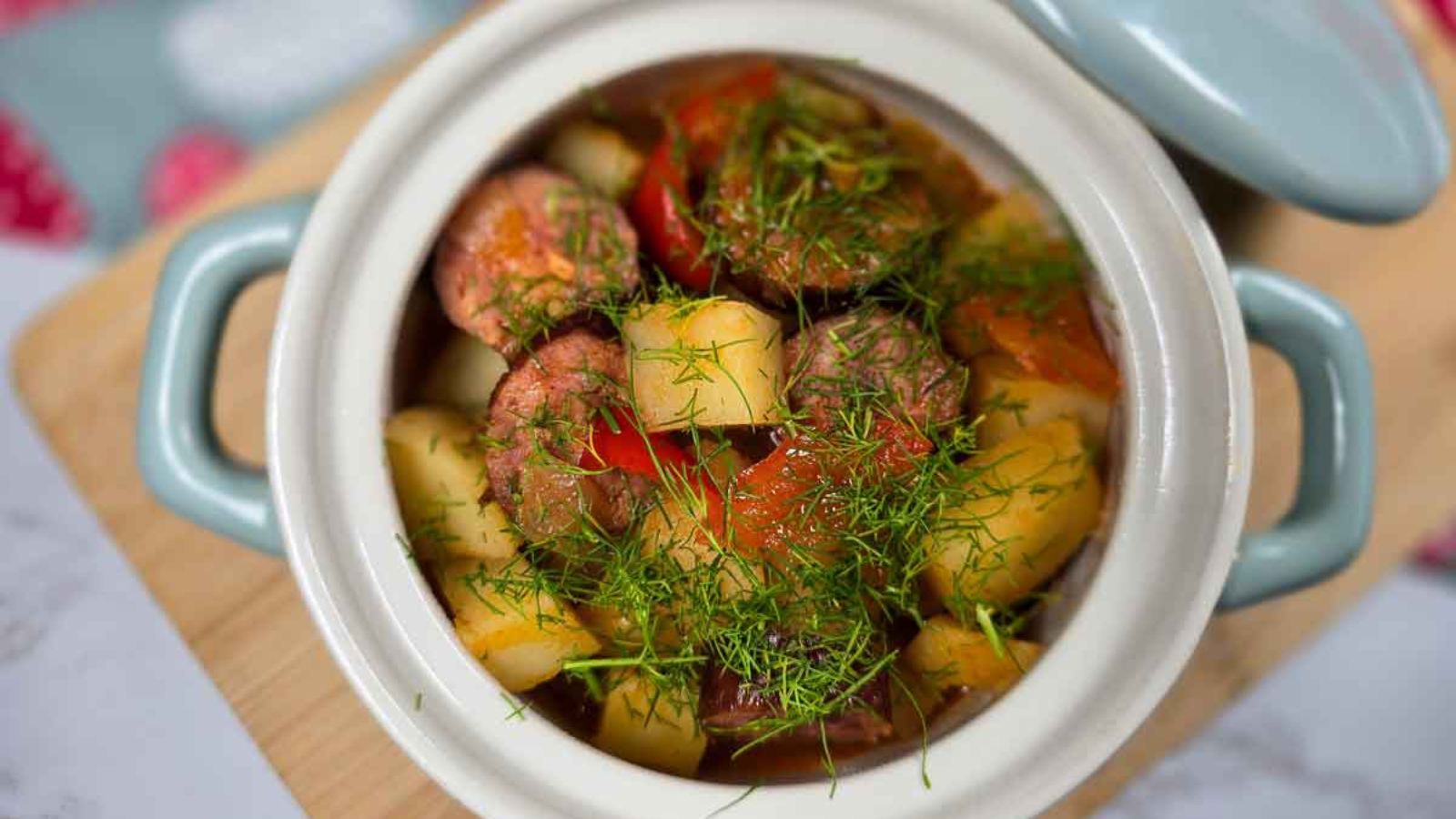 Potato and sausage casserole in a bowl.