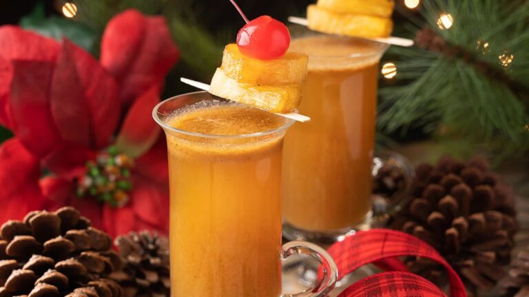 Rum toddy with pineapple and cherry.