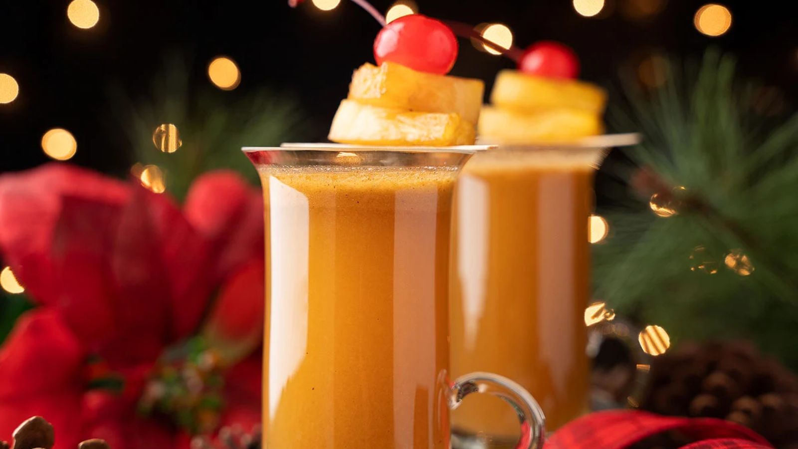Rum toddy with pineapple and cherry.