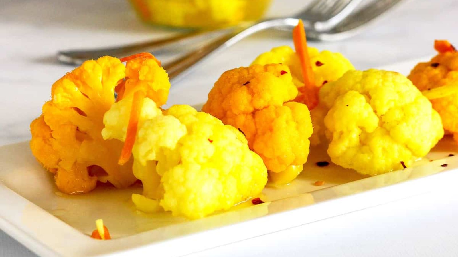 Pickled cauliflower on a plate.