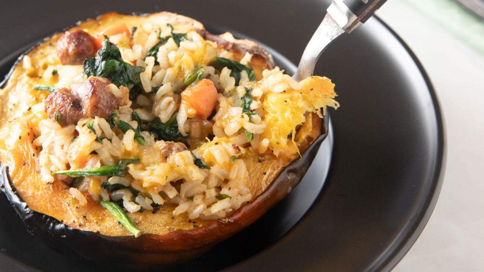 Stuffed acorn squash with rice and vegetable filling.