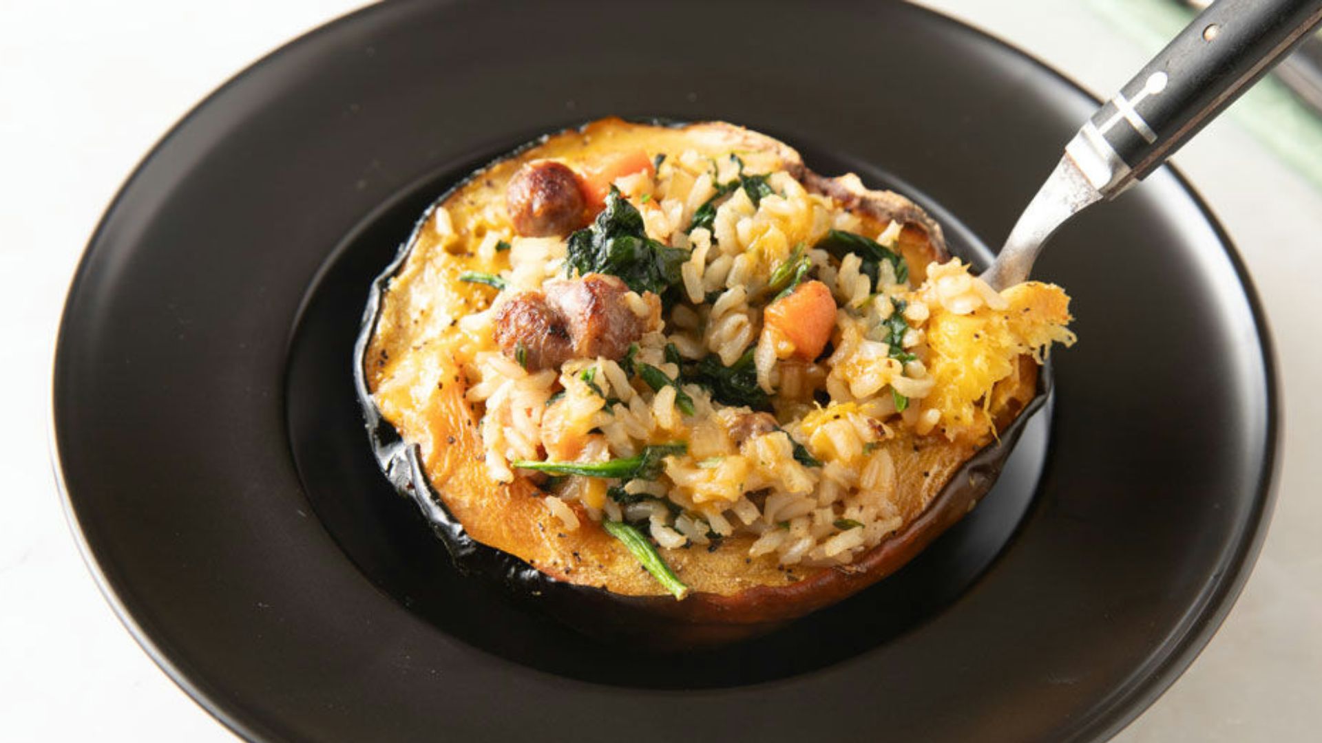 Stuffed acorn squash with rice and vegetable filling.