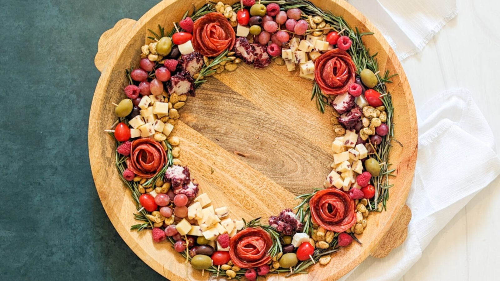 Charcuterie wreath on wooden board.
