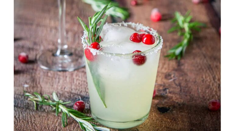 Margarita with cranberries and rosemary.