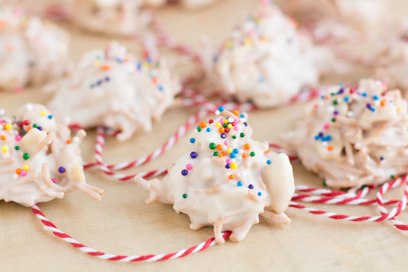 White Chocolate Haystacks with a red and white string on a white background.