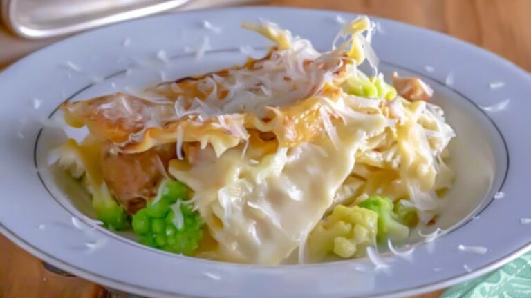 White lasagna with Romanesco in white bowl.