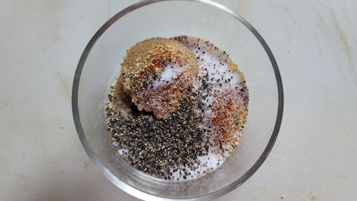 Spices added to a small bowl.