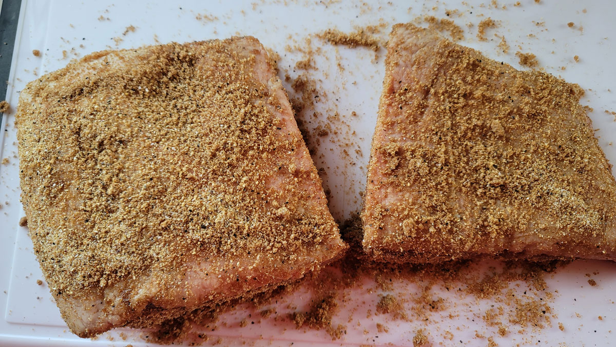 Brisket pieces rubbed with the dry rub.