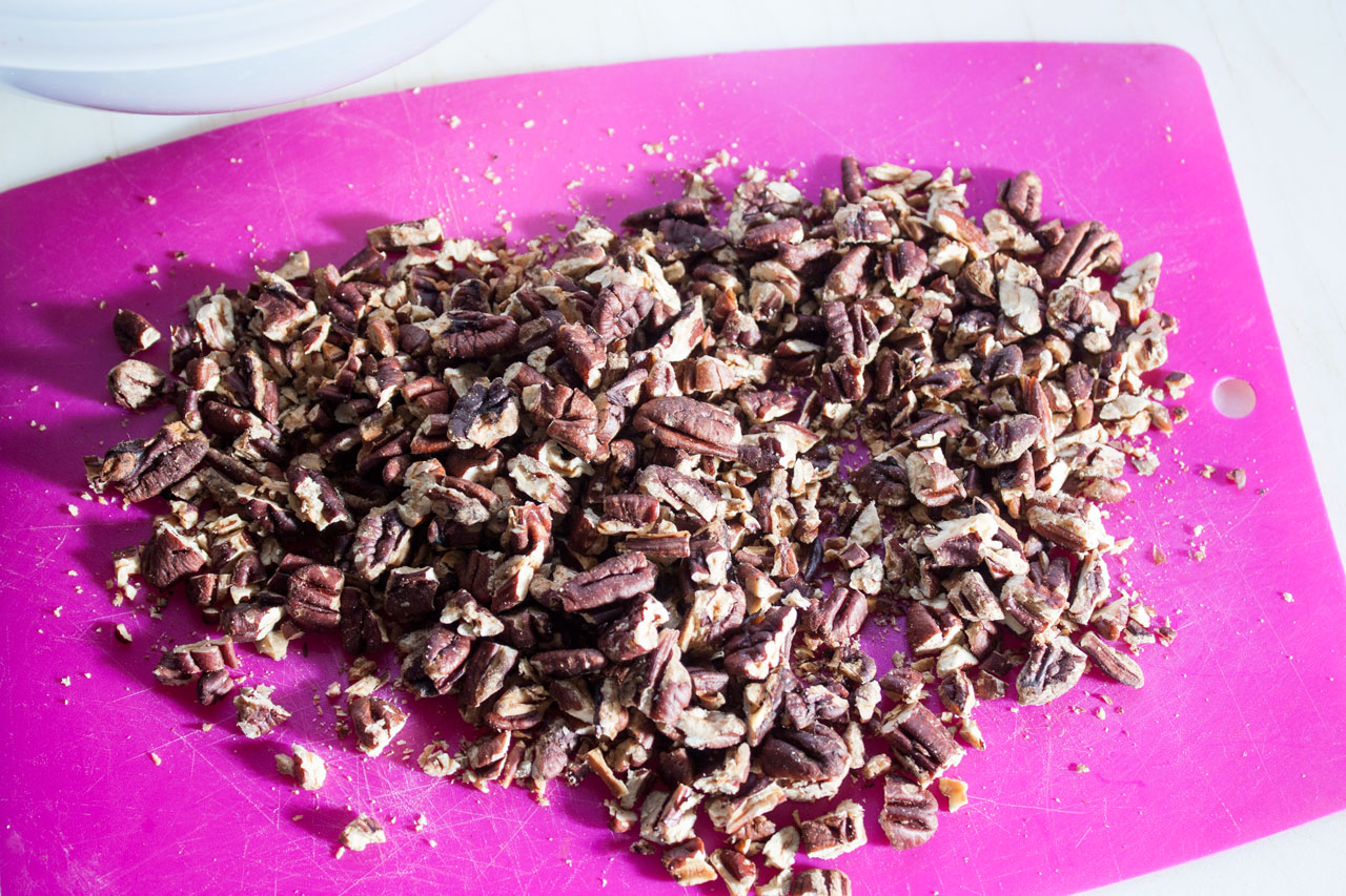 Chopped pecans in a bowl.