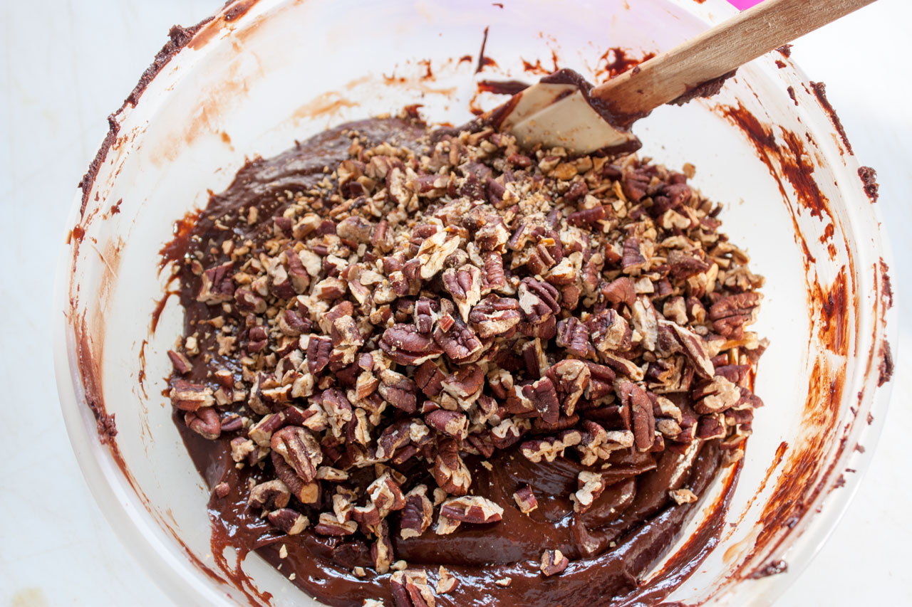 Pecans added to the bowl with the fudge.