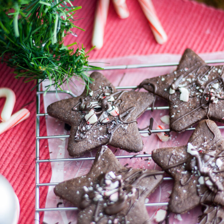 Chocolate star cookies drizzled in chocolate and topped with peppermint pieces.