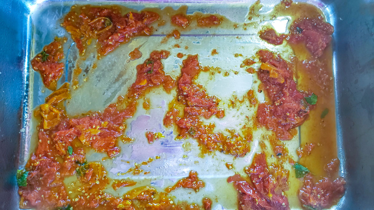 Tomatoes spread in a lasagna pan.