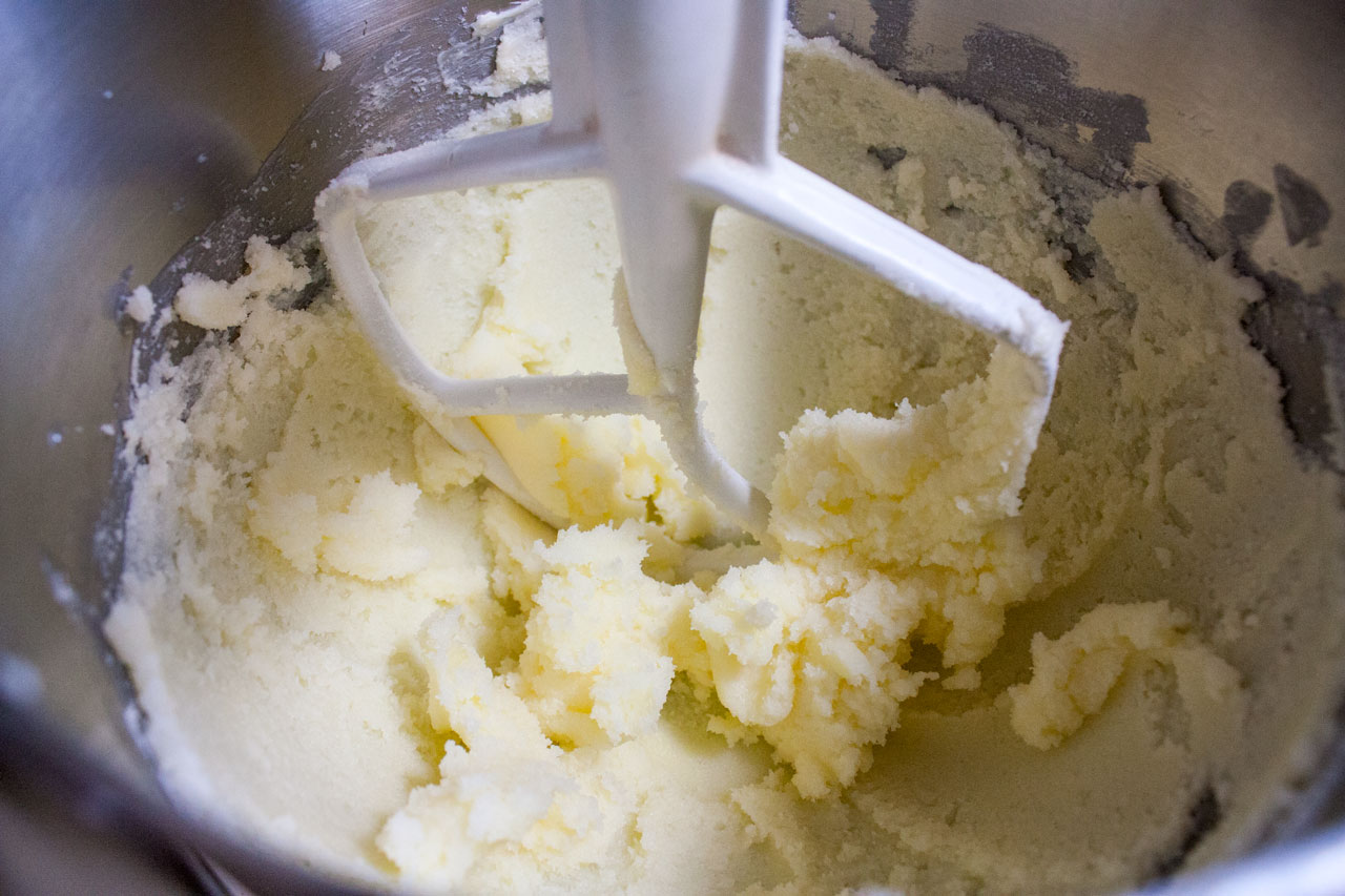 Butter and sugar creamed together in a bowl.
