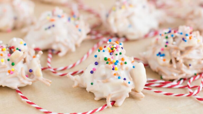 White chocolate haystack cookies with a red and white string.