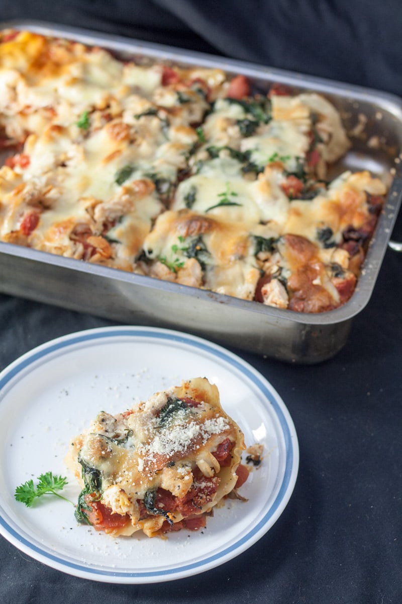 slice of chicken florentine lasagna on white plate