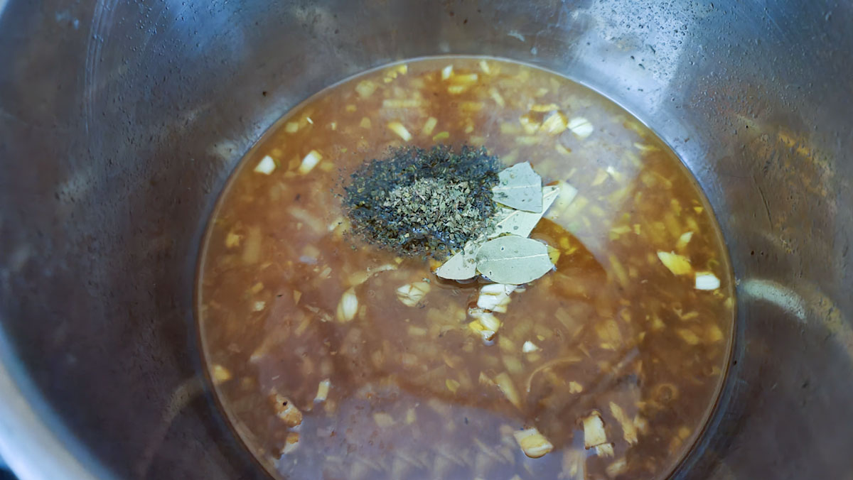 Juice and stock added to the pot.