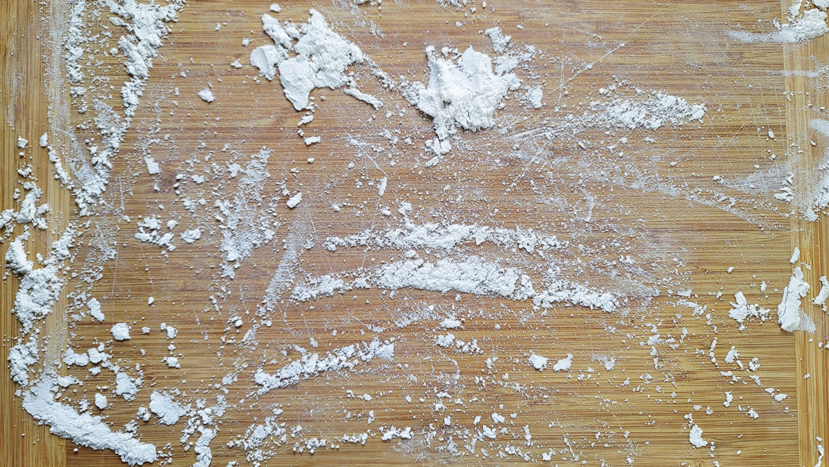 Flour on a wooden board.
