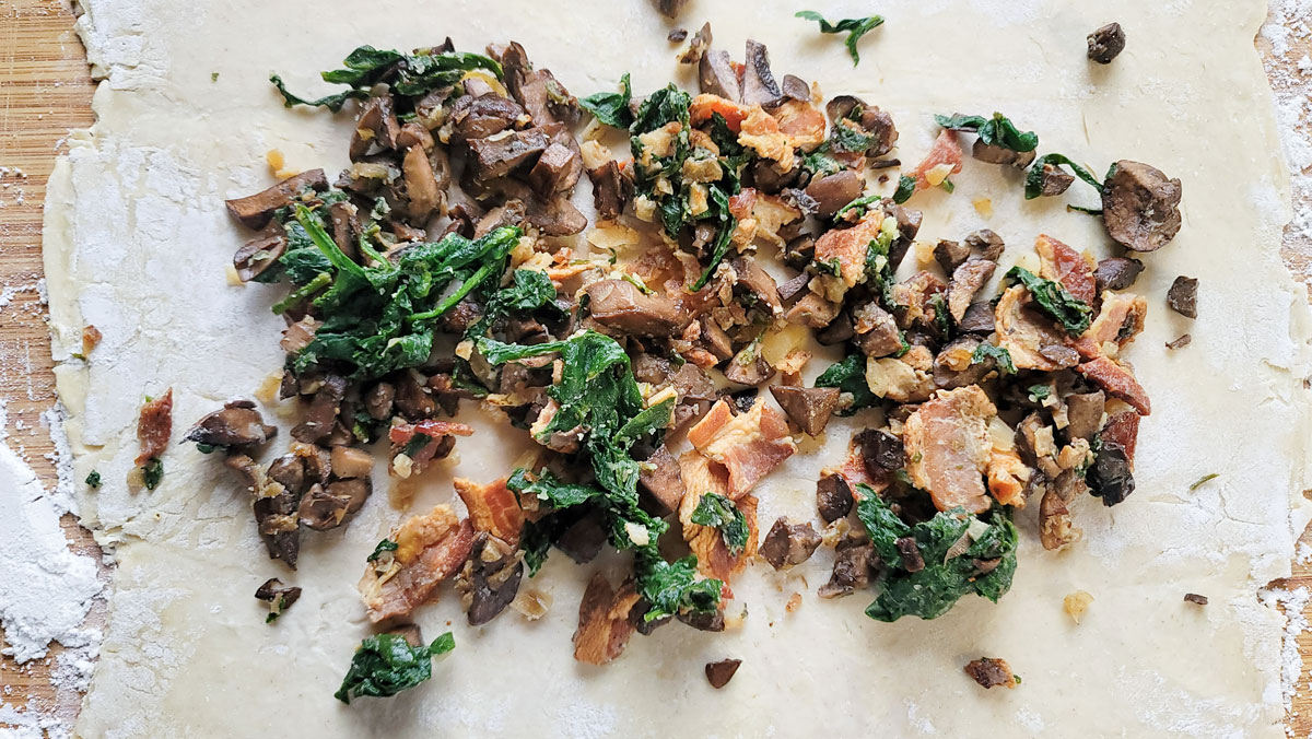 Duxelles filling on puff pastry.