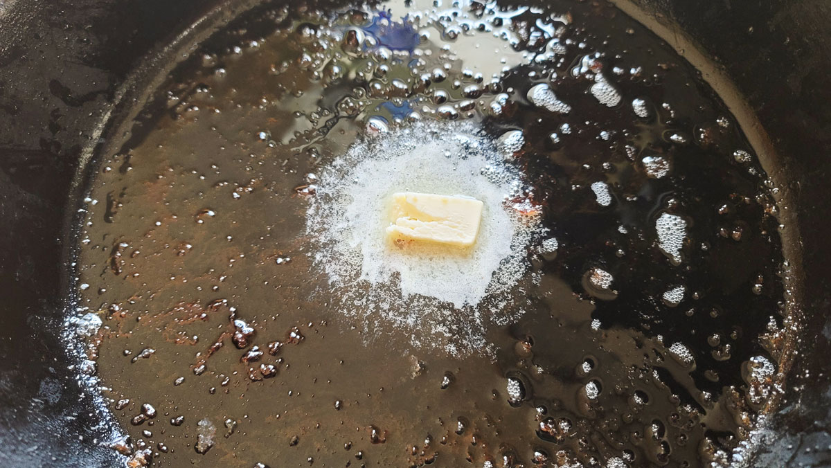 Butter melting in a cast iron pan.