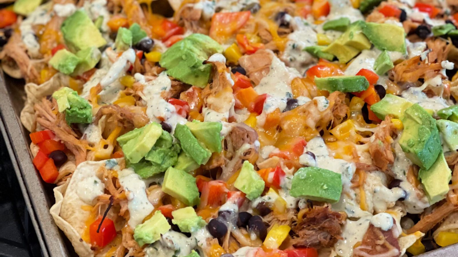 Loaded nachos on a tray.
