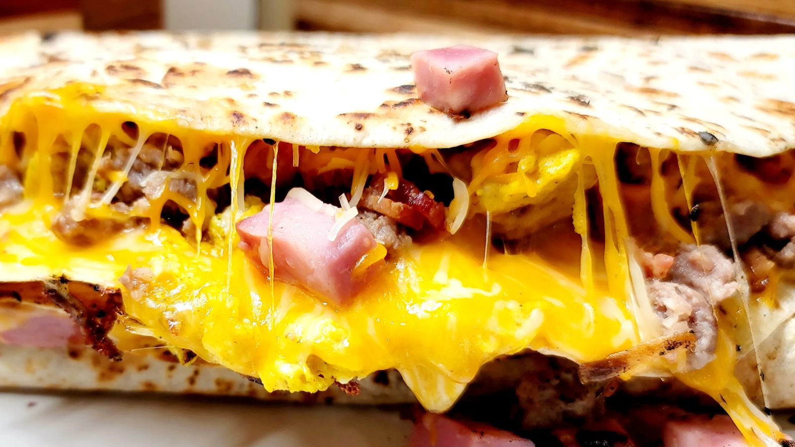 Quesadillas with gooey cheese and ham.