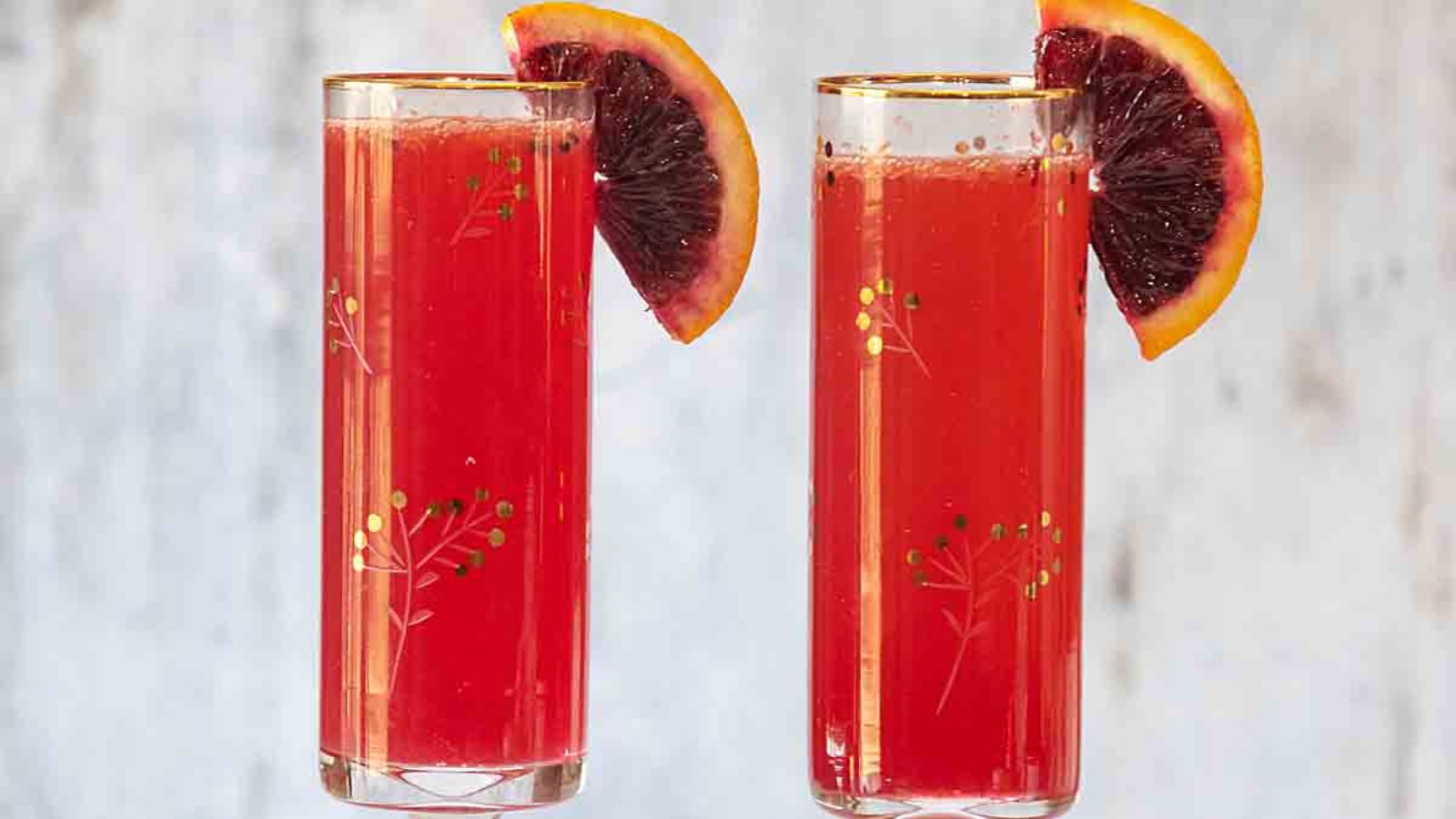 Two glasses of blood orange mimosa.