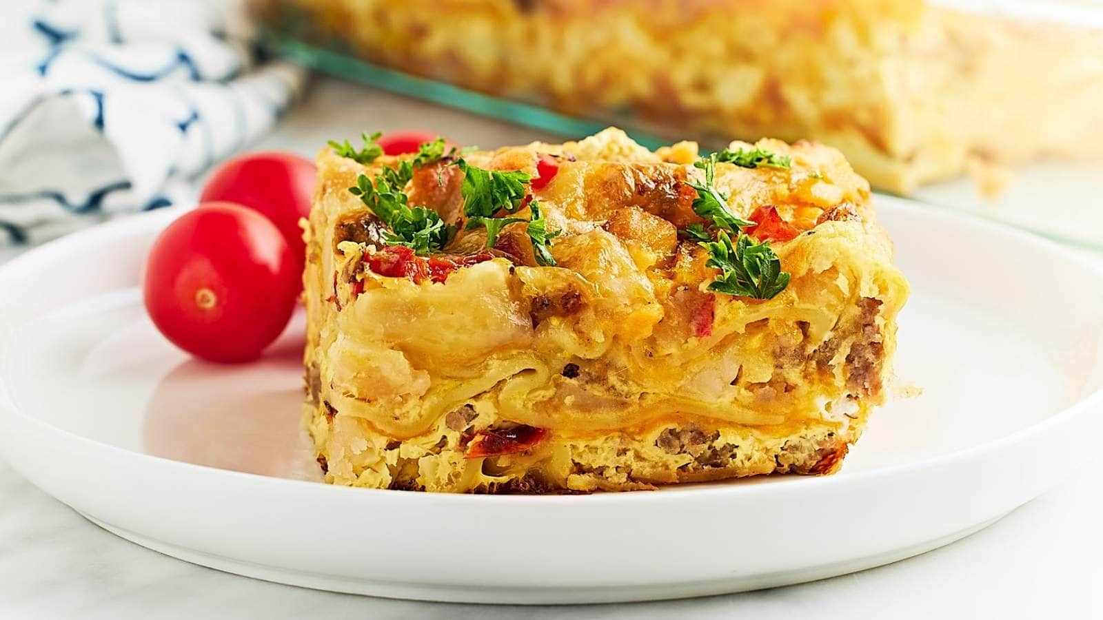 A slice of lasagna on a plate.