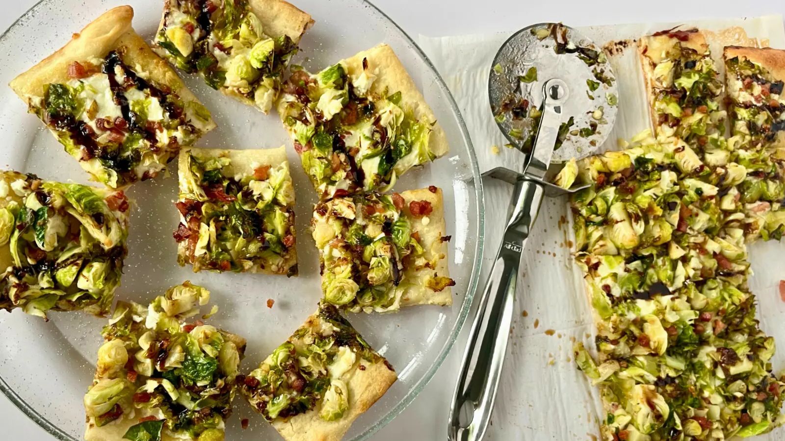 Brussel sprout pizza slices on a plate.