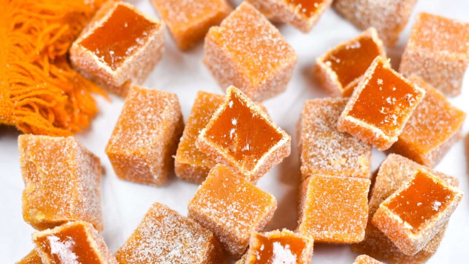 Carrot candies on a white background.