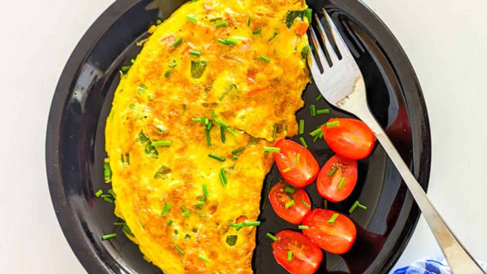 Carrot omelette with cherry tomatoes.