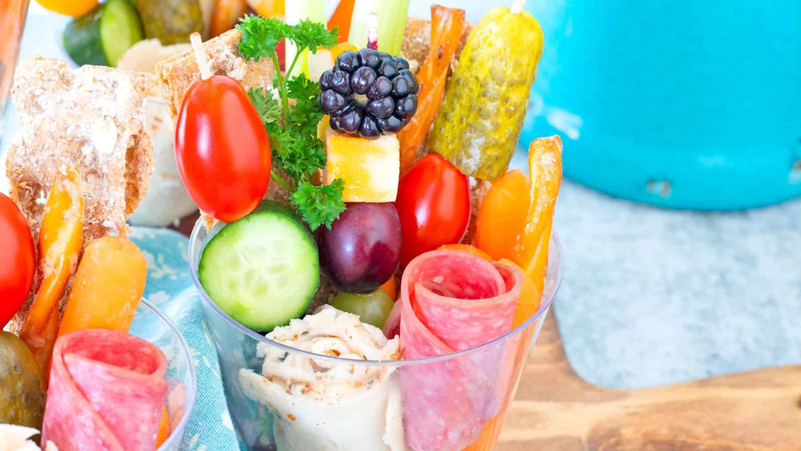 Mixed appetizers and snacks in a cup.