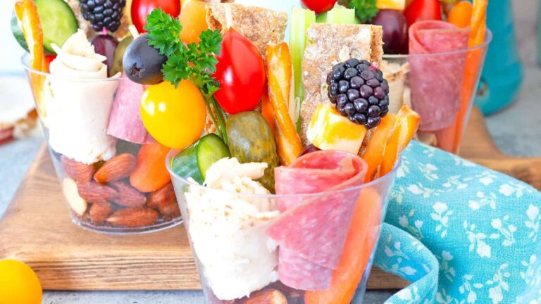 Mixed appetizers and snacks in a cup.