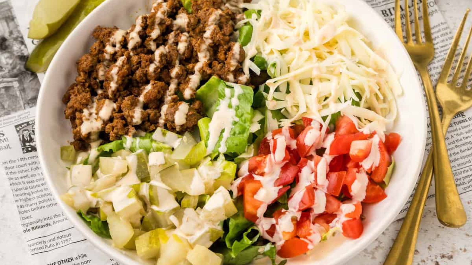 Chesseburger salad in a bowl.