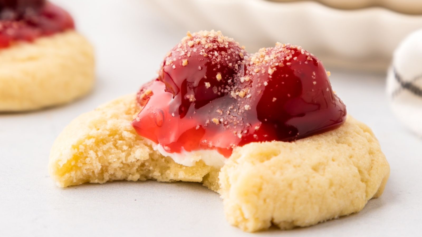 Cheesecake cookie with cherries on top.