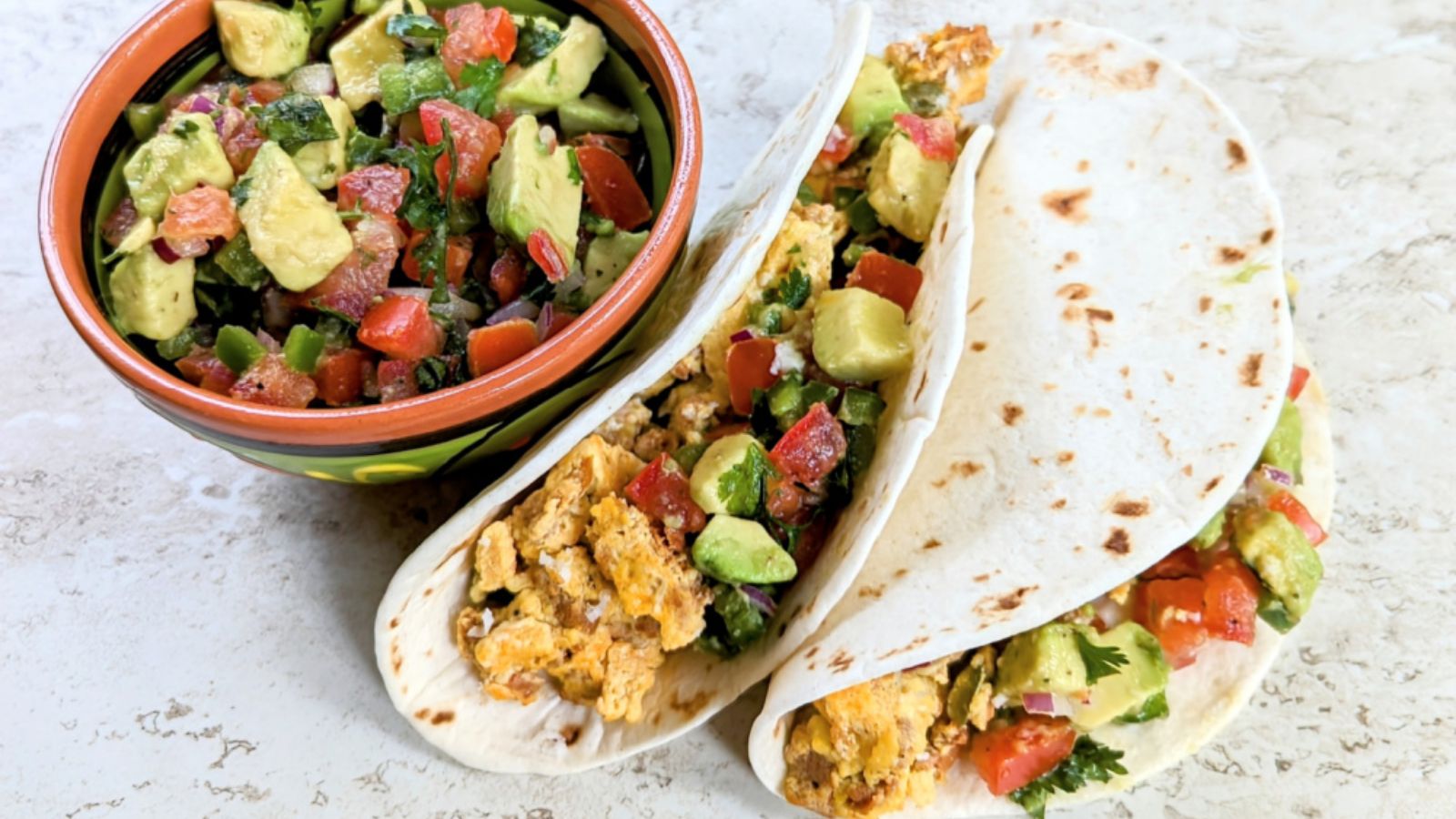 Tacos with chorizo, avocados and peppers.