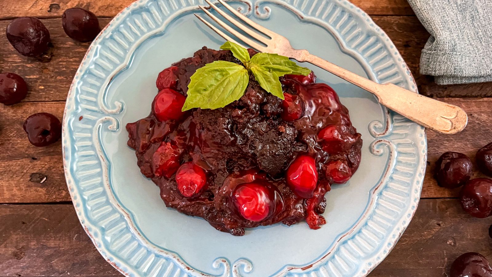 Chocolate cake with cherries.