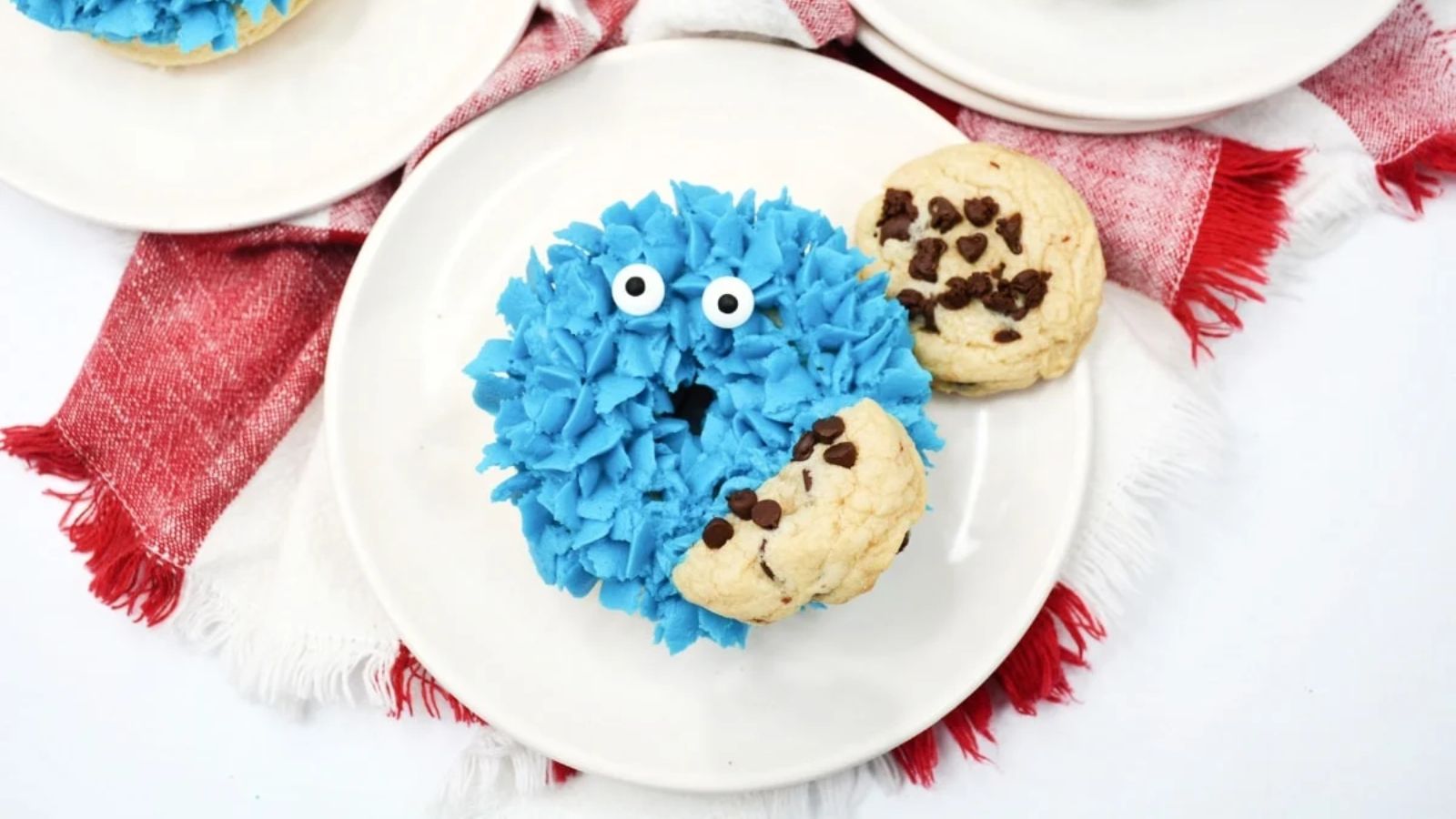Cookie monster donut on a plate.