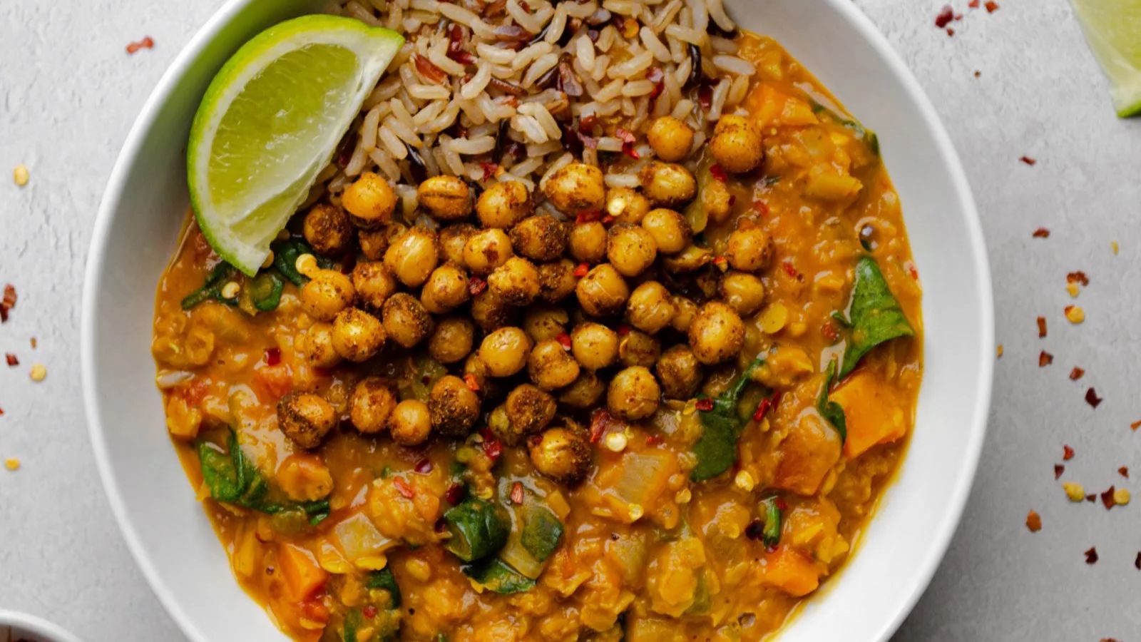 Chickpea and lentil with sliced lime on the side.