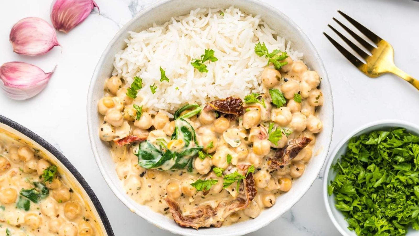 Rice and creamy chickpeas on a plate.