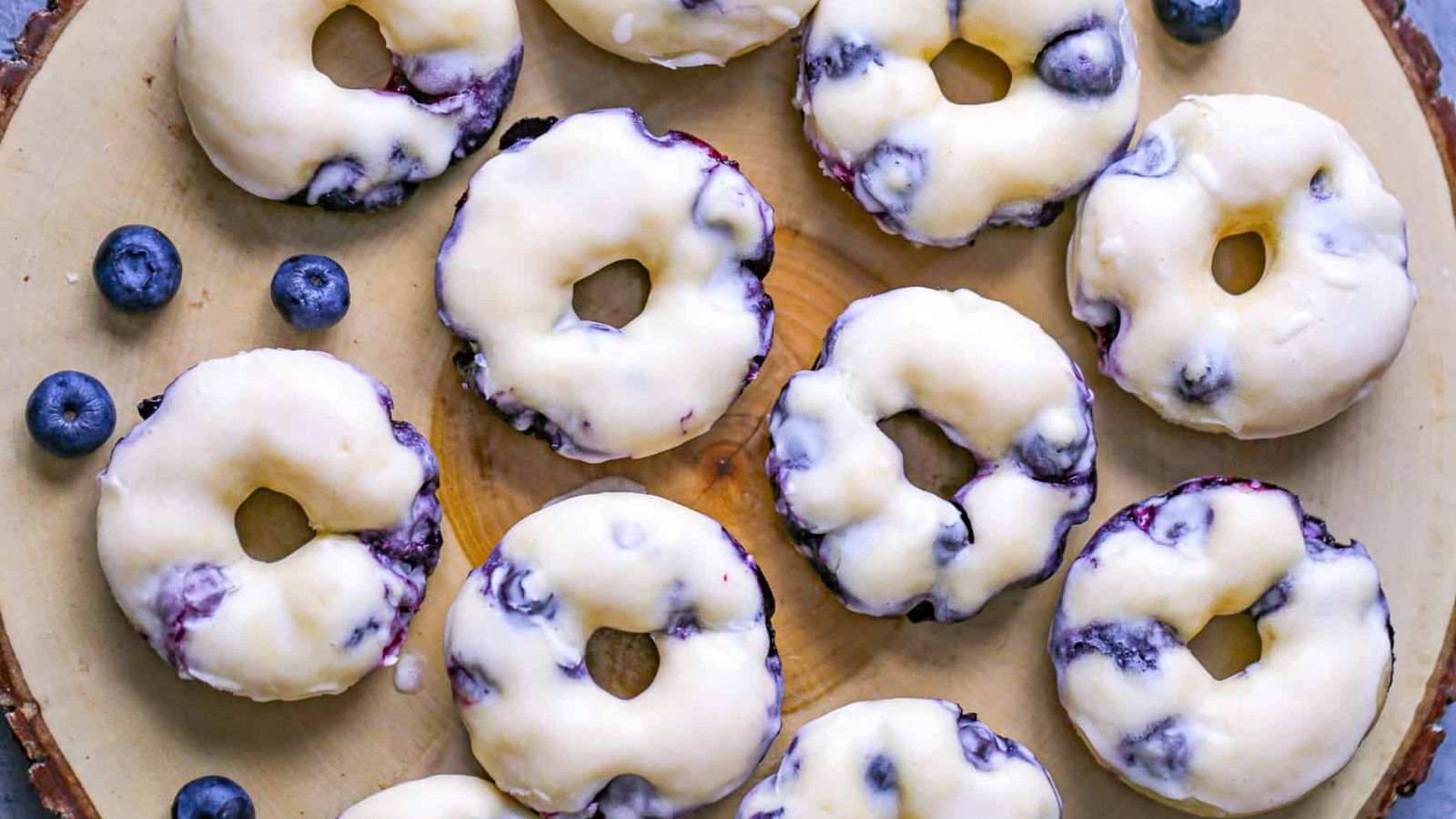 Glazed donuts with blueberries.