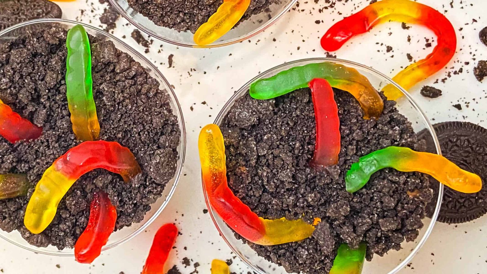 Two dirt cups with gummy worms.
