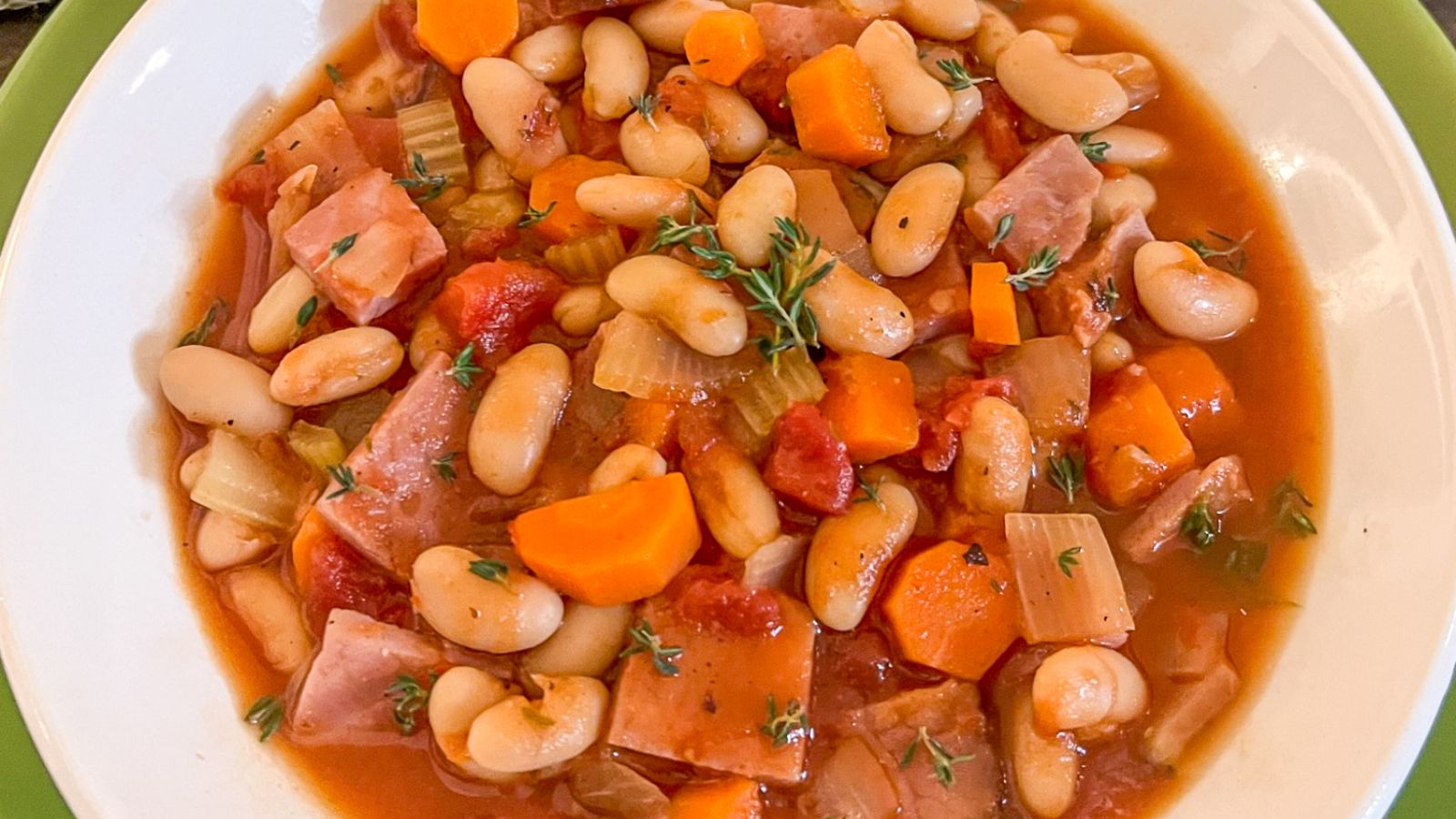 Ham and bean soup in a bowl.
