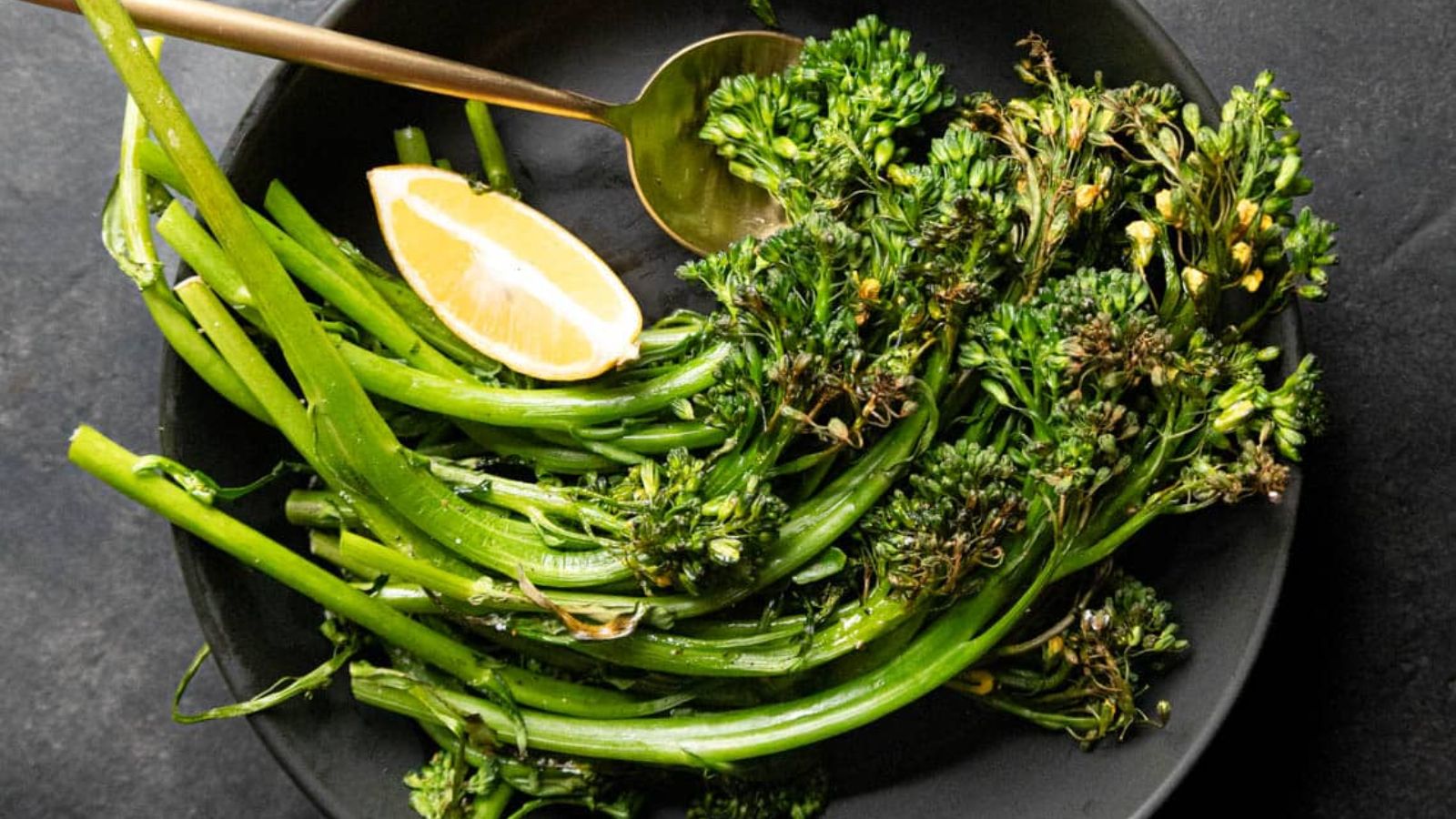Air fried broccolini on a plate.